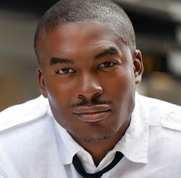 A man with a white shirt and black tie