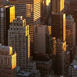 A view of the city from above at sunset.