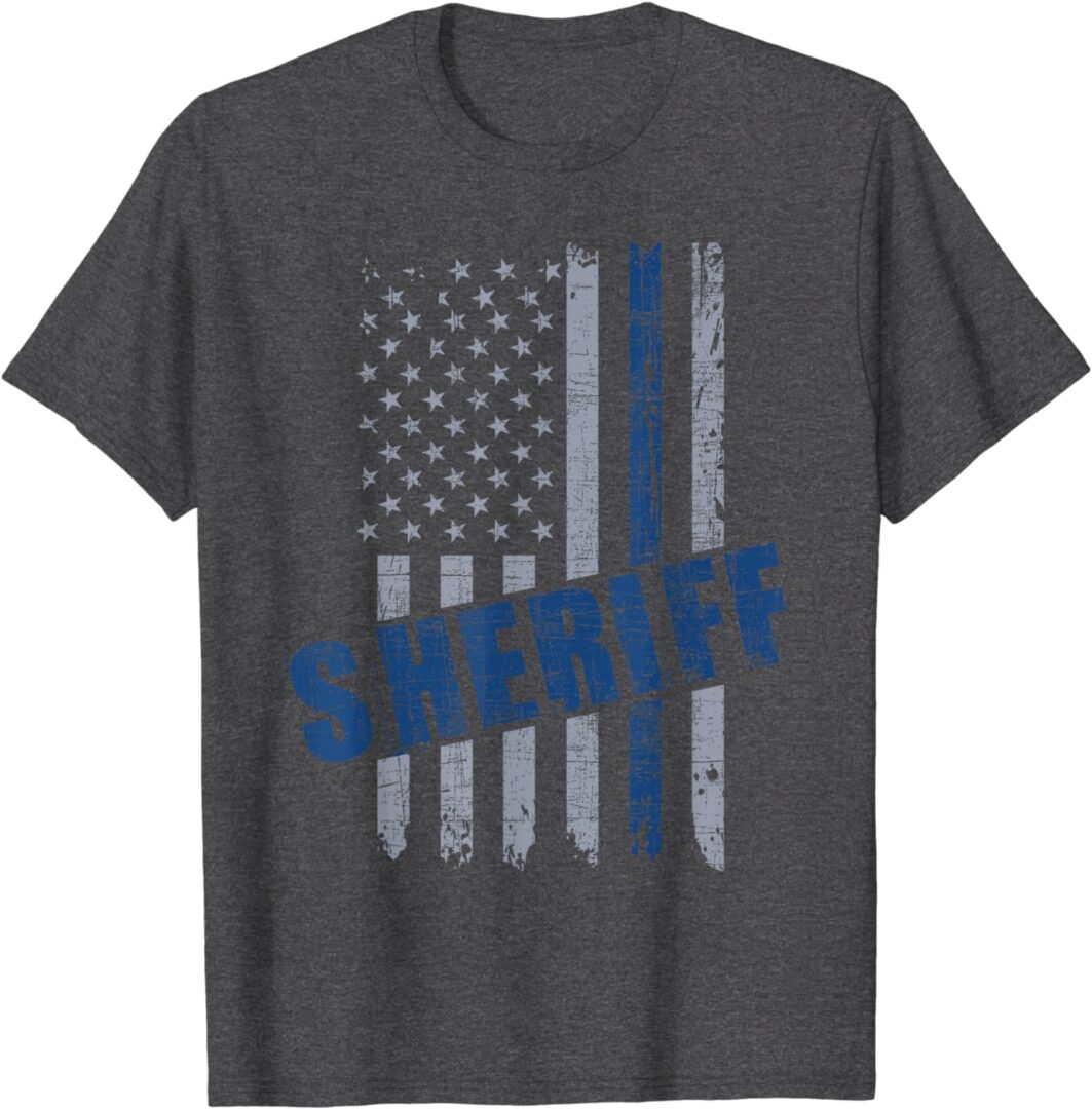 A police officer 's flag shirt with the word sheriff on it.